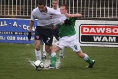 Northern Ireland and England players battle through torrential rain