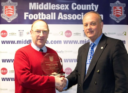 Bob Chandler presented with award fro 40 years service to schools' football